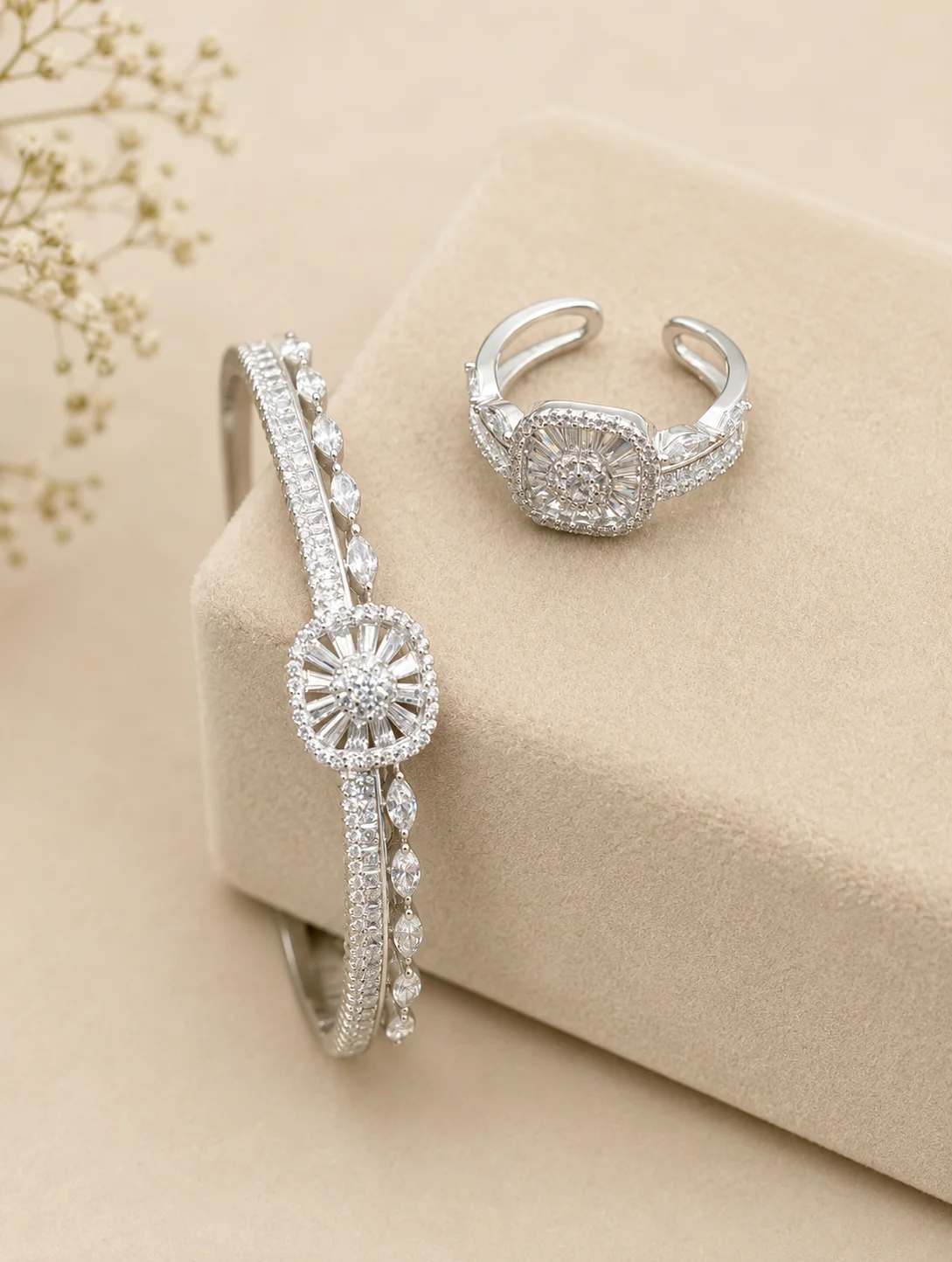 Silver ring and bracelet set featuring a matching square centerpiece and sparkling white stones.