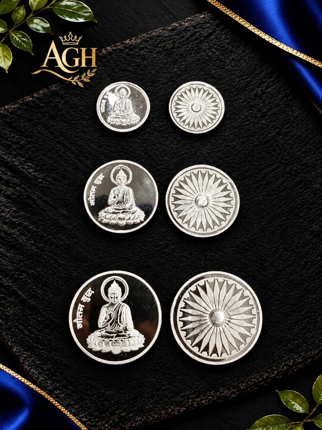 Round silver coins featuring Gautam Buddha figure on one side and a chakra wheel pattern on the reverse.