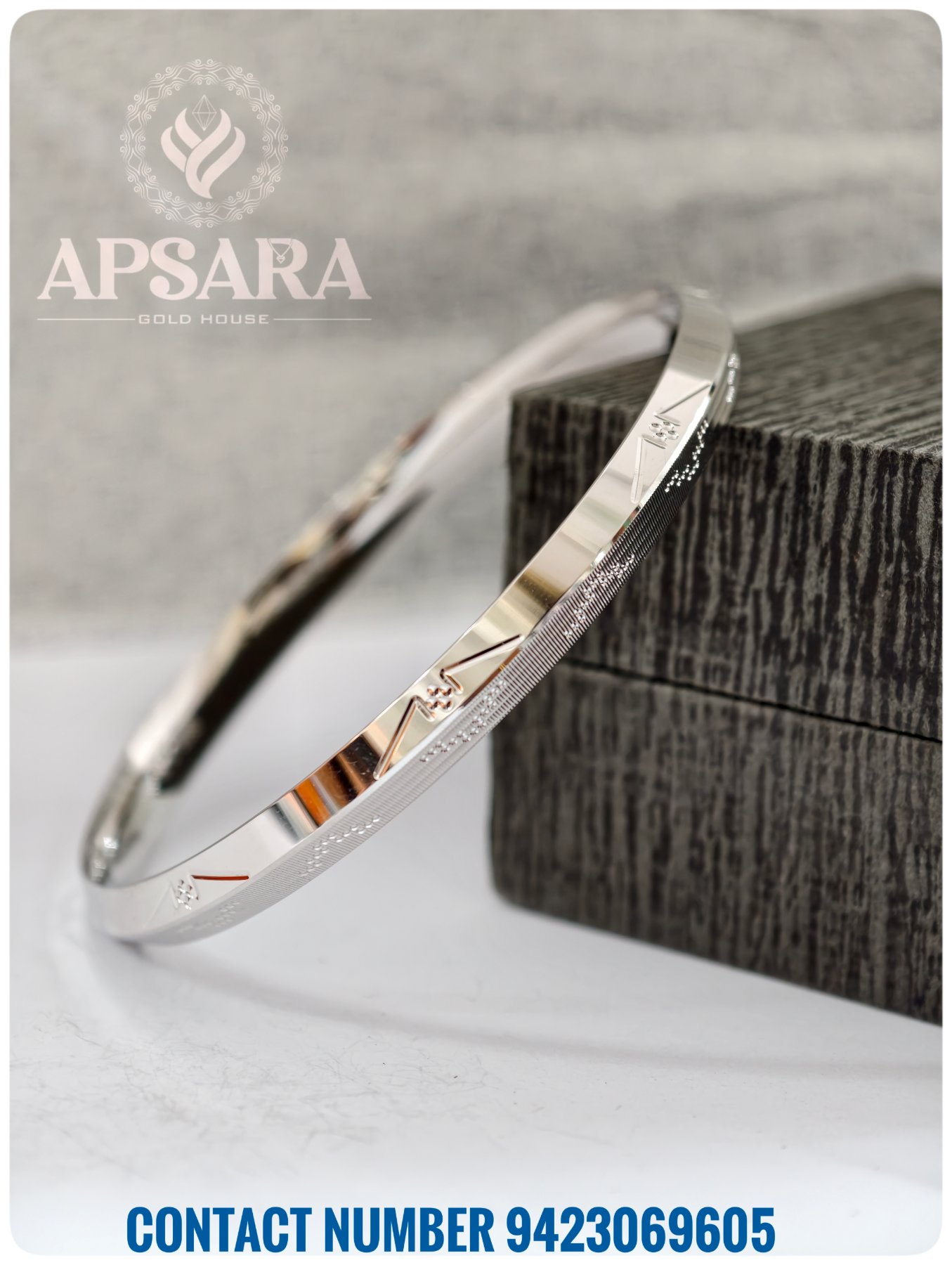 A shiny silver kada with a flat surface, geometric CNC cut patterns, and fine texturing for men.
