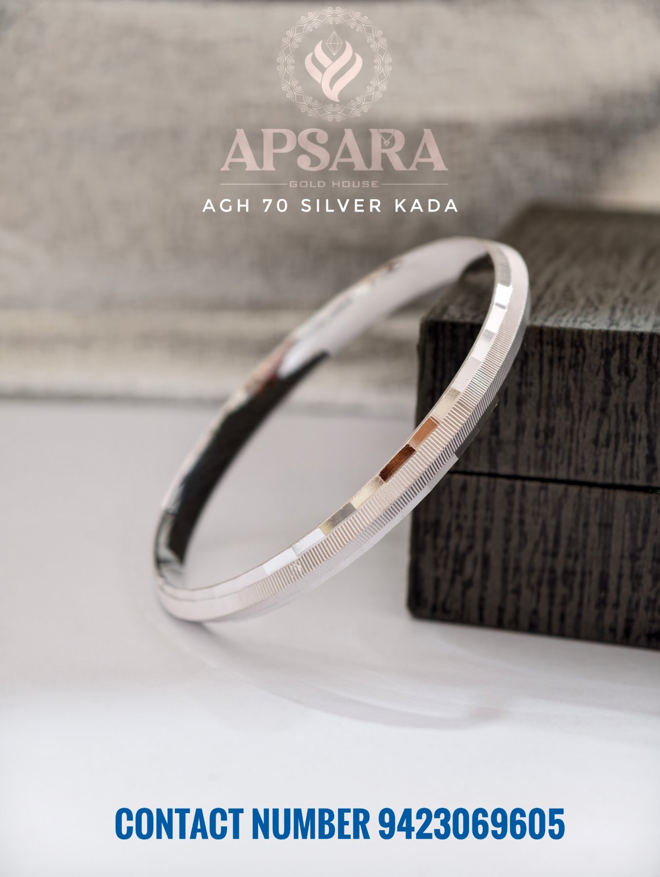A plain silver CNC Punjabi kada featuring a polished metallic finish with fine textured cuts.