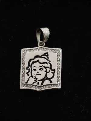 Oxidised silver locket featuring a deity portrait engraved inside a stone-studded rectangular border with a matching bail.