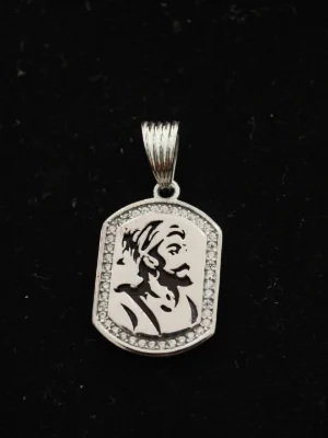 Silver rectangular locket featuring a royal figure portrait, bordered with white stones and attached to a grooved bail.