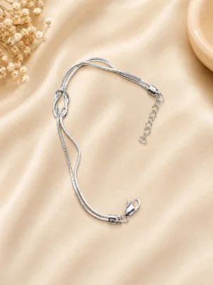 Glossy silver bracelet featuring a dual strand design with a central knot and an adjustable chain.