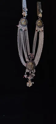 Oxidised silver multi strand half waist chain with deity motifs, floral accents, hanging bells, and colourful beads.