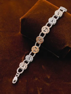 This stylish silver Italian bracelet features alternating round links with silver and dual tone patterns.