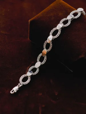 Silver Italian bracelet featuring alternate mesh links and smooth oval metal pieces with a lobster clasp.