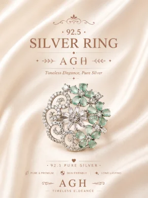 Silver ring featuring white CZ stones and green stones in floral and scroll patterns with a shiny finish.