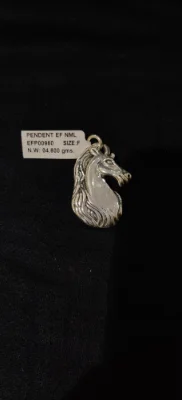 Oxidised silver animal locket shaped like a horse head with detailed mane.