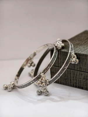 Silver oxidised bangles with leaf pattern and hanging ghungroos.