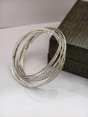 Oxidised silver designer bangles featuring a textured finish.