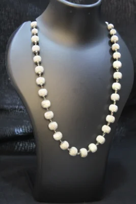 Sterling silver beaded necklace featuring textured round beads in a silver finish.